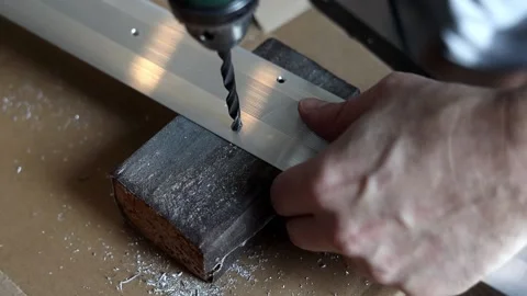 Drill close-up. The master drills holes in the metal panel. Stock Footage 197445173