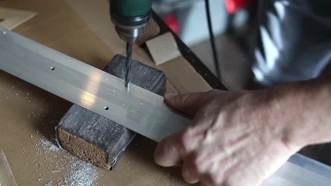 Drill close-up. The master drills holes in the metal panel. Stock Footage 197445174