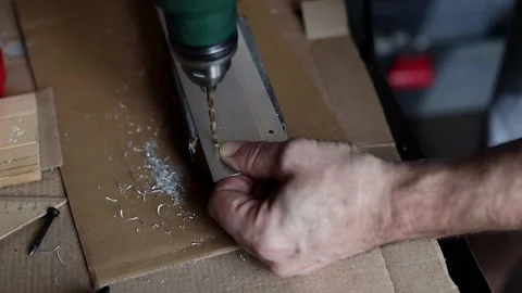 Drill close-up. The master drills holes in the metal panel. Stock Footage 197445179