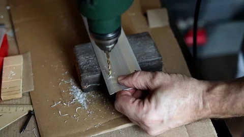 Drill close-up. The master drills holes in the metal panel. Stock Footage 197445181