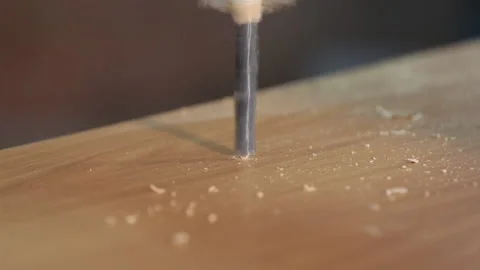 Drill Close-up. Worker Makes Hole in Chipboard. Metal Drill Easily Punches Wood Stock Footage 147311067