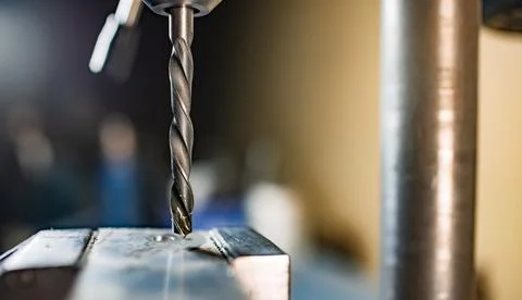 Drill close-up at the workplace in workshop Foto stock