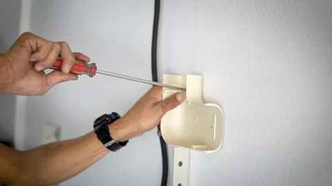 Drill drills a nail into the Cement wall Stock Footage 123259138
