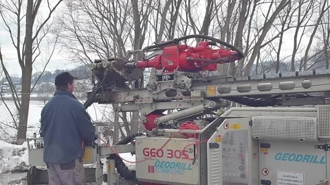 Drill into the earth with big machine 06 Stock Footage 133845087