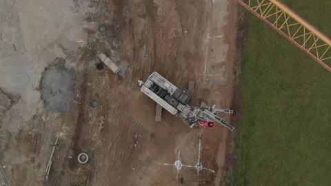 Drill into the earth with big machine AERIAL 10 Stock Footage 133848869