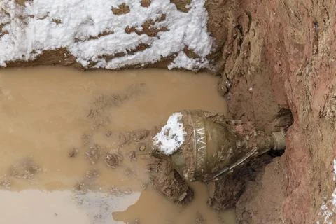 Drill in an earthen hole. Stock Photos