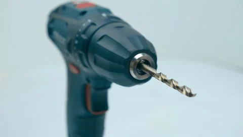 With a drill function, a household cordless screwdriver with a drill for holes 스톡 동영상 259683574