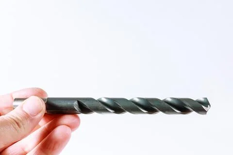 Drill in hand on a white background Stock Photos