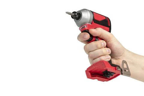Drill in hand on a white isolated background. Cordless drill or screwdriver in a Stock Photos