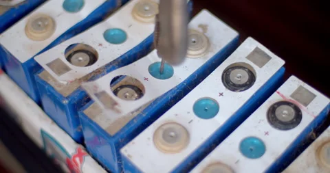 Drill a hole in the lithium battery to release the pressure.Lithium batteries. Stock Footage 310912006