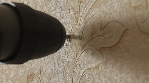 Drill a hole in the wall Stock Footage 97716864