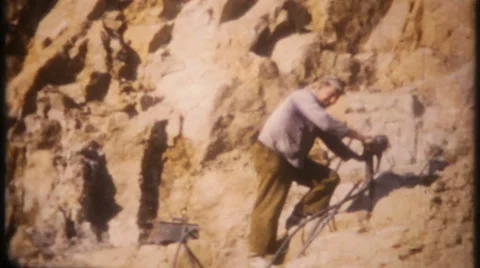 Drill holes, dynamite blasting at rock quarry 1950s vintage film home movie 3143 Stock Footage 58994625