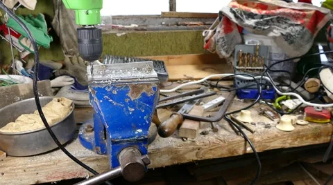 Drill machine drilling metal plate in garage Stock-Footage 63117699