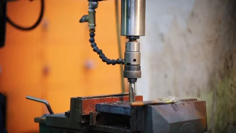 The drill of the machine falls on the material Stock Footage 110486969