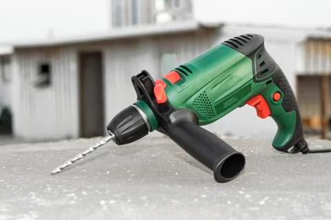 Drill machine kept on a construction site  on the floor Stockfoto's