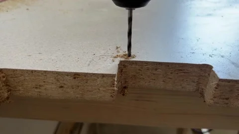 A drill makes a hole in the countertop. Stock Footage 288453330