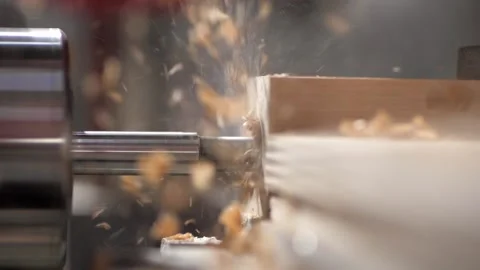 A drill makes a hole in a wooden board. Production of furniture. Video stock 207077853