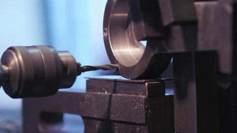 A drill is making a hole in a metal part Stock Footage 78733782