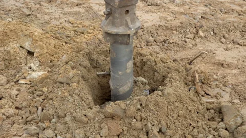 A drill for making holes in the ground. Stock Footage 308594281