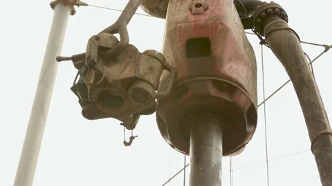 Drill pipe and rig tong on the rig floor while making up for drilling. Drawworks Stock Footage 222822300