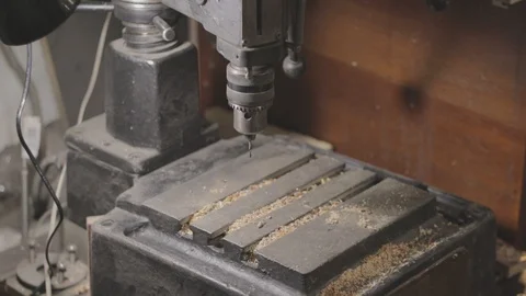 Drill press is being cleaned with a vacuum cleaner Vidéo 106264009