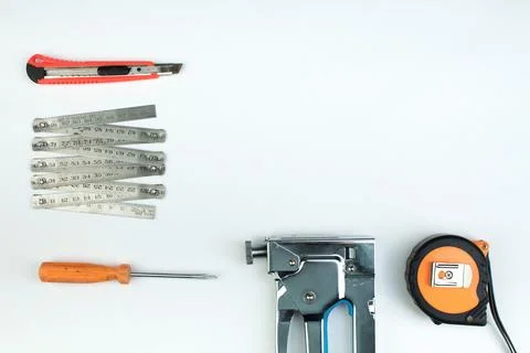 Drill, putty knife, screwdrivers construction stapler on white background. .. Foto stock