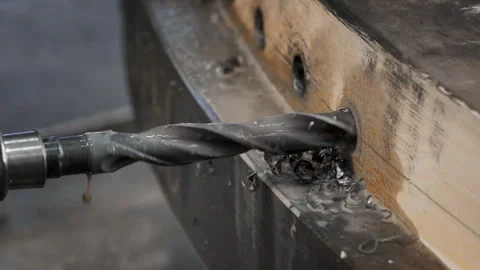 Drill Rotating While Processing Steel Detail And Leaving Production Shavings Video stock 240651292