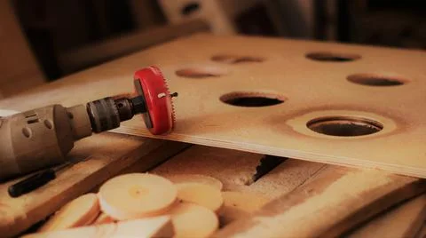 Drill with a round nozzle in a carpentry workshop Stock Photos