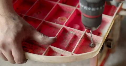 Drill the rusty nut head to remove the damaged nut.The pressure of drilling. Stock Footage 282381410