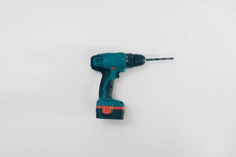 Drill screwdriver on a white background isolation. Copy space on top. Constru Stock Photos