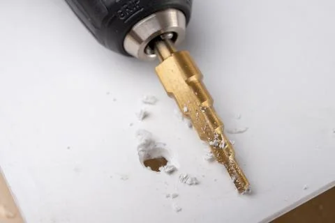 Drill in the shape of a cone for quick drilling. Accessories for mechanics. Stock Photos