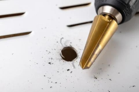 Drill in the shape of a cone for quick drilling. Accessories for mechanics. Stock Photos