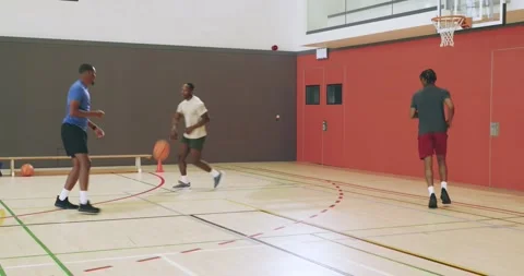 At drill start african american teammates passing and shooting to practice Stock Footage 342492017