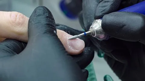 Drill for stripping nails in the hands of a master Stock Photos