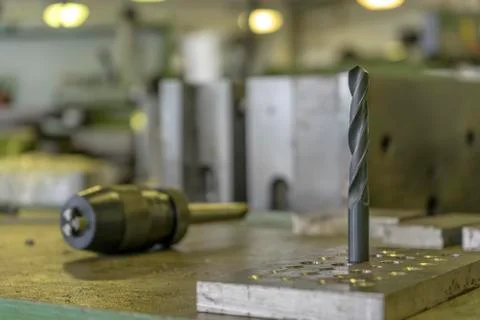 Drill on the table in mold shop Stock Photos