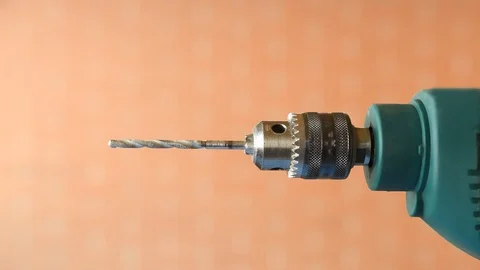 Drill turning until it stops on a clear background. Video stock 127502830