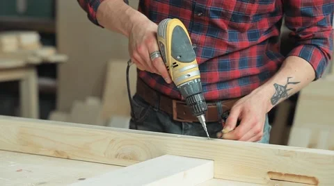 Drill the wood with a screwdriver Stock Footage 61815897