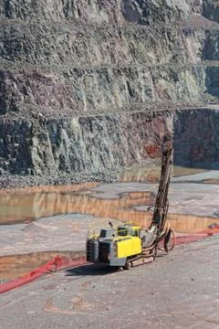 Driller machine in a quarry mine. open pit. Stock Photos