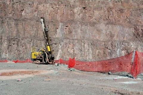 Driller in an open pit mine Stock Photos