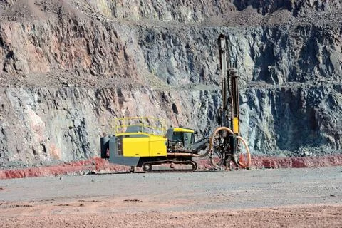 Driller in an open pit mine Stock Photos