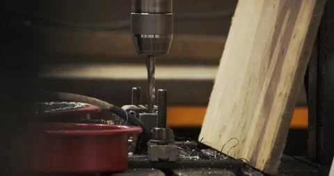 Drilling and milling CNC in workshop. Professional skilled metal work factory Stock Footage 168413652