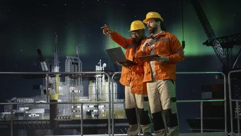 Drilling barge engineering team men analyze oil crisis logistics with laptop Stock Photos