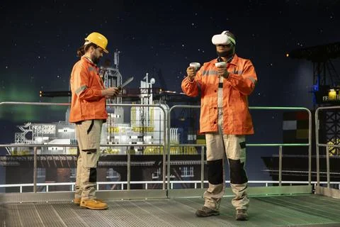 Drilling barge specialist analyzing gear performance with virtual reality tech Stock Photos