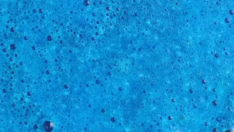 Drilling blue fluid. Cobalt blue foam and bubbles when dissolving a salt co.. Stock Footage 273675760