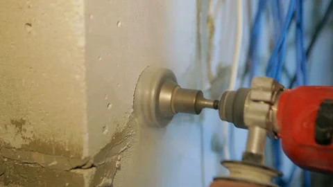 Drilling a brick wall for an electrical outlet. Video stock 102167943