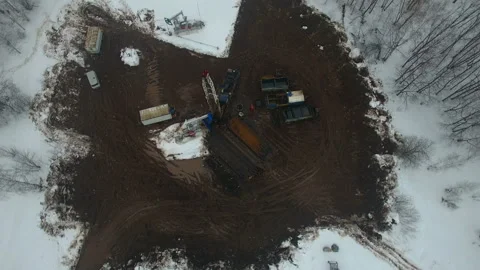 Drilling a deep well with a drilling rig in an oil and gas field in winter Stock Footage 105574407