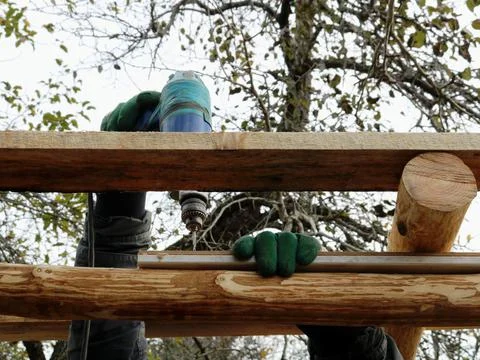 Drilling during construction from logs Stock Photos
