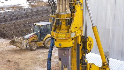 Drilling equipment makes a hole for the pole, at the construction site Video stock 72544540