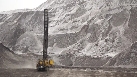 Drilling for explosives in a pit in winter Stock Footage 106914224