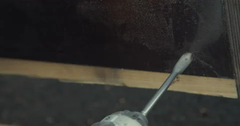 Drilling by hand screwdriver in a painted board Video stock 131336193